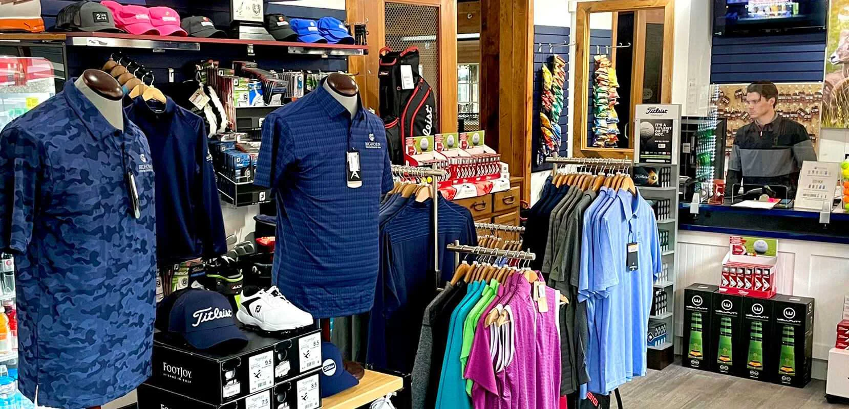 Golf pro shop interior featuring apparel, accessories, and equipment displays at Bighorn Golf & Country Club